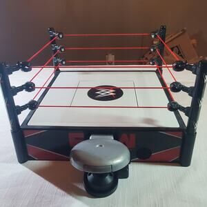 Mattel WWE Superstar Ring playset with a spring-loaded mat and real flex ropes
